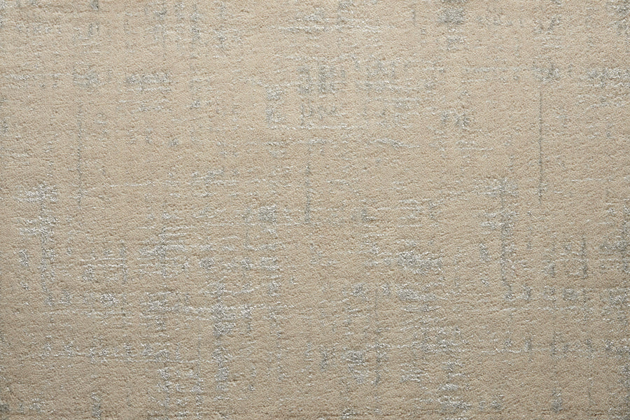 A close-up of the Velvet Abstract On Trend Carpet in ecru shows its soft velvet texture and subtle, irregular light gray pattern for a modern, abstract look.