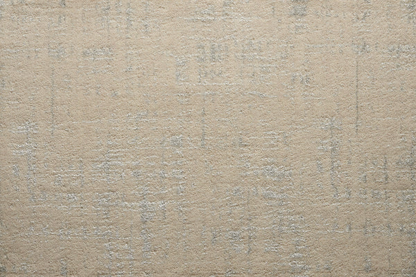 A close-up of the Velvet Abstract On Trend Carpet in ecru shows its soft velvet texture and subtle, irregular light gray pattern for a modern, abstract look.