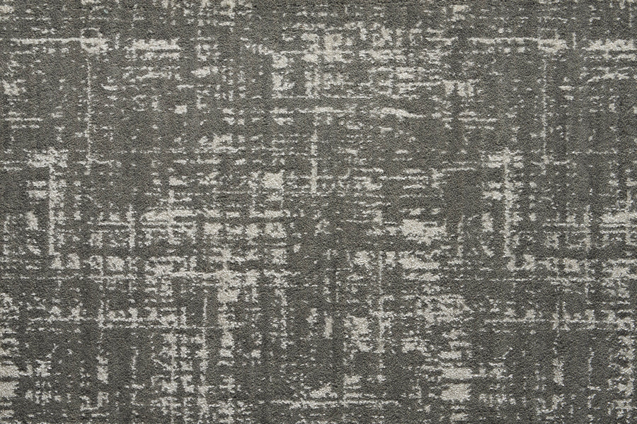 The Velvet Abstract On Trend Carpet in Silhouette features a contemporary crosshatched pattern in shades of gray and white, blending modern style with the elegance of velvet for a chic, distressed look.