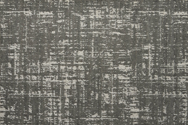 The Velvet Abstract On Trend Carpet in Silhouette features a contemporary crosshatched pattern in shades of gray and white, blending modern style with the elegance of velvet for a chic, distressed look.