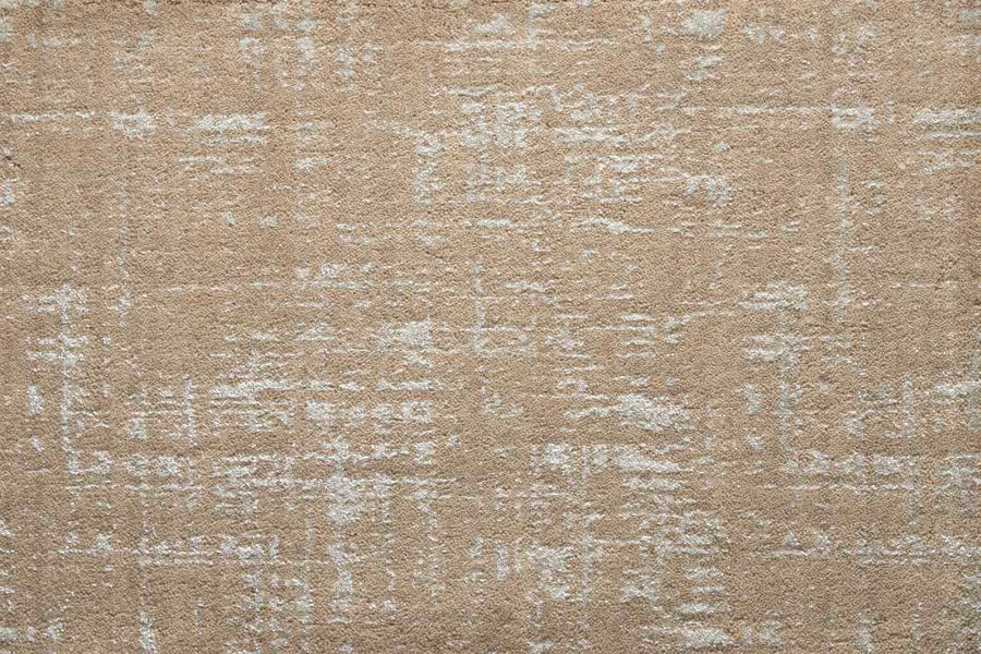 The Velvet Abstract On Trend Carpet in Tannery features plush velvet and a subtle, irregular white pattern for a textured, contemporary look.