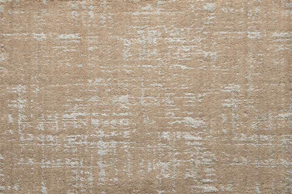 The Velvet Abstract On Trend Carpet in Tannery features plush velvet and a subtle, irregular white pattern for a textured, contemporary look.
