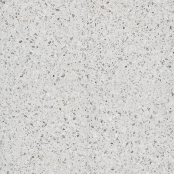 Coretec Solid Polymer Core Vinyl Tile features four square terrazzo tiles with a light gray base and scattered gray, white, and beige stone fragments, creating a subtle pattern at intersections—perfect for stylish, durable luxury flooring.