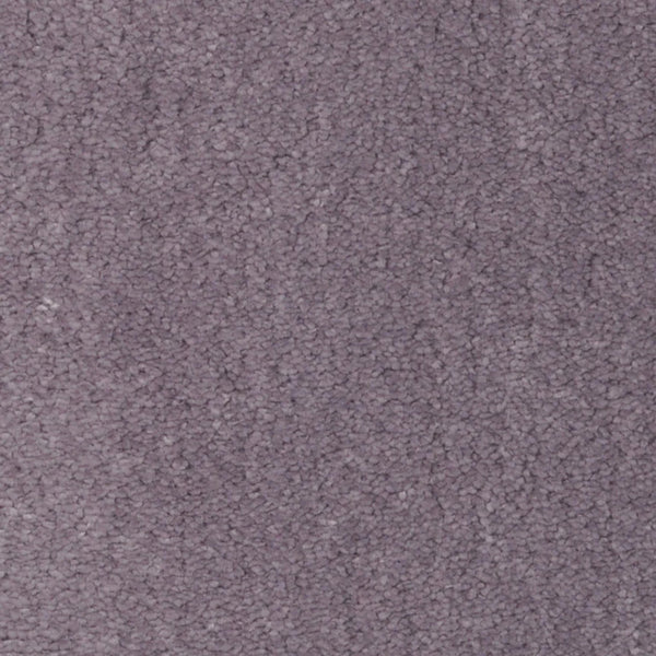 A close-up of the Seduction On Trend Carpet in Veiled Plum shows its soft, densely packed fibers and textured surface for a luxurious look.