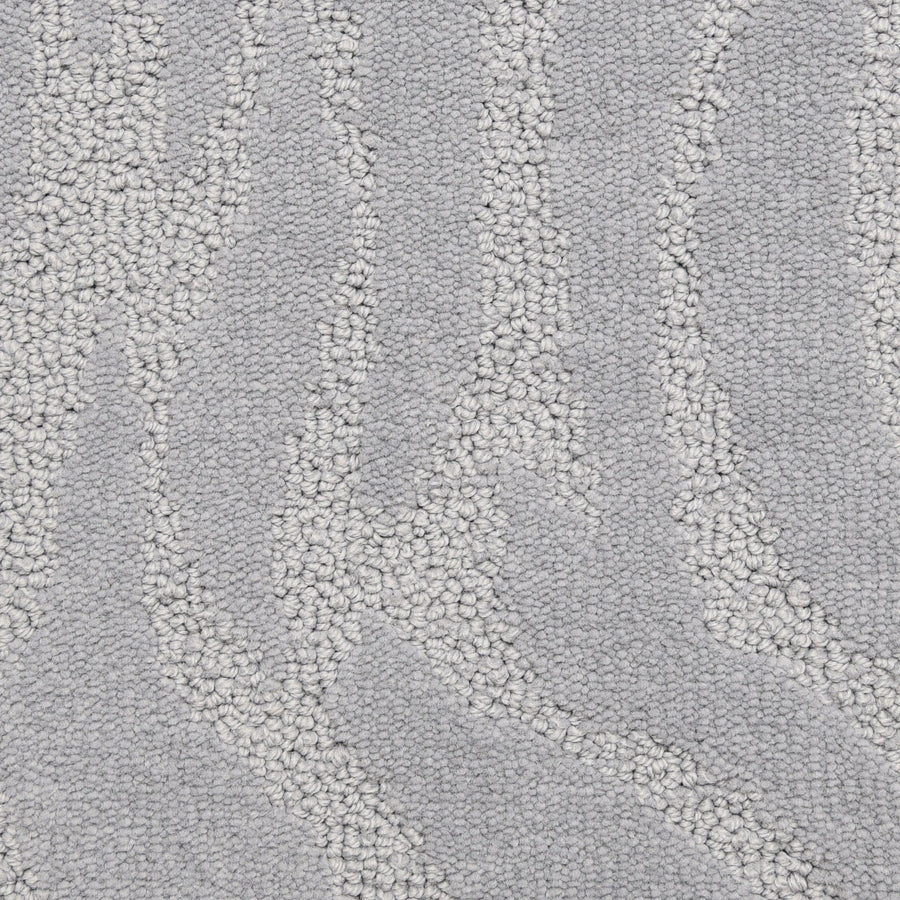 Close-up of Capetown On Trend Carpet in Victoria Basin, a light gray hue with a subtle wave-like pattern from raised looped fibers. This luxury carpet brings depth, movement, and comfort to high-traffic areas while elevating your style.