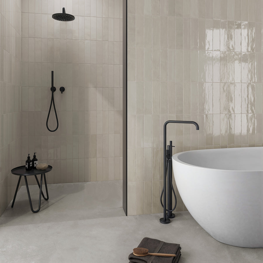A bathroom with a tub and shower.