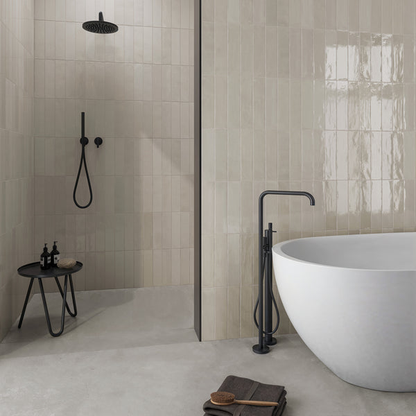 A bathroom with a tub and shower.