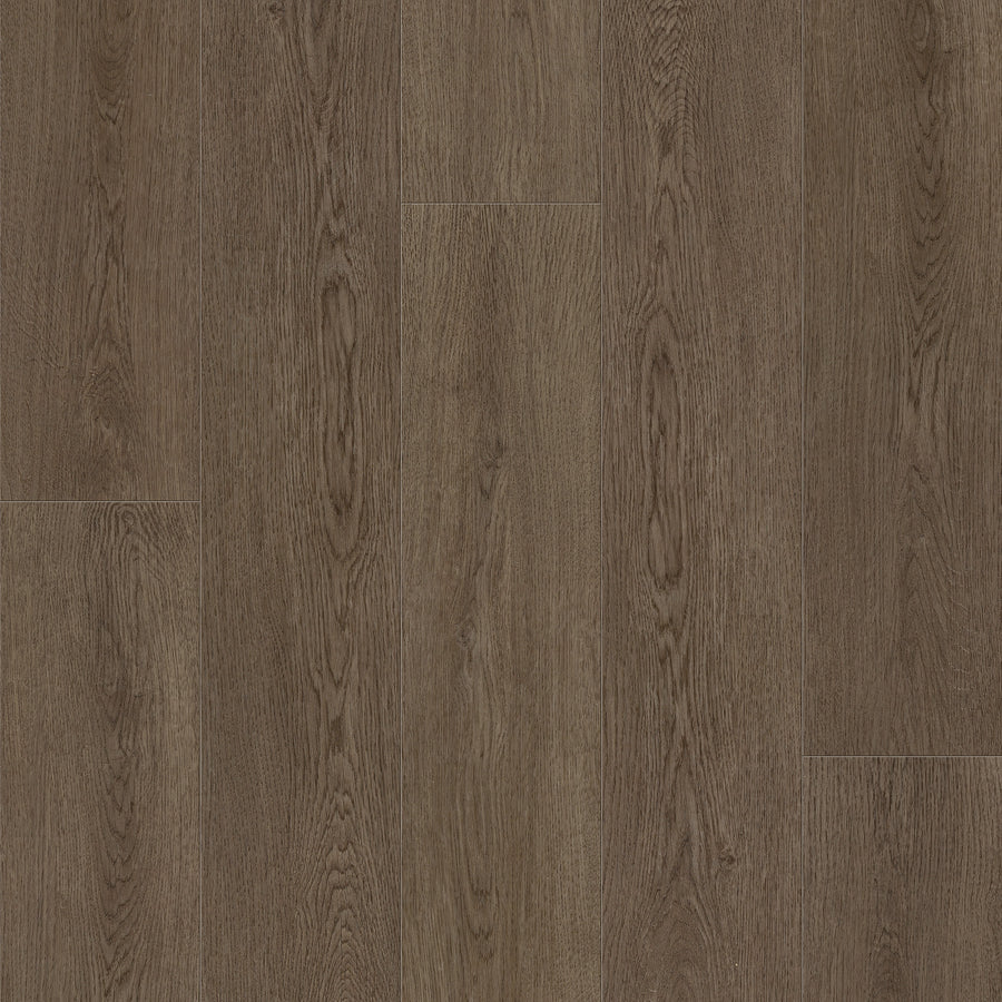 Close-up of Coretec Originals Classics Vinyl flooring in medium-brown, featuring distinct wood grain patterns and staggered seams that highlight its rigid core construction.