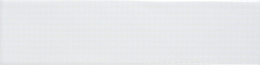 The Gradient 3" x 12" Ceramic Tile in White Gloss features a subtle diagonal texture and glossy finish, creating a modern, gradient-like effect perfect for vertical installations.
