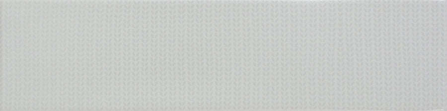A close-up of the Gradient 3" x 12" Ceramic Tile in White Matte, showcasing a subtle, repeating pattern of short horizontal lines that creates a textured, fabric-like surface.