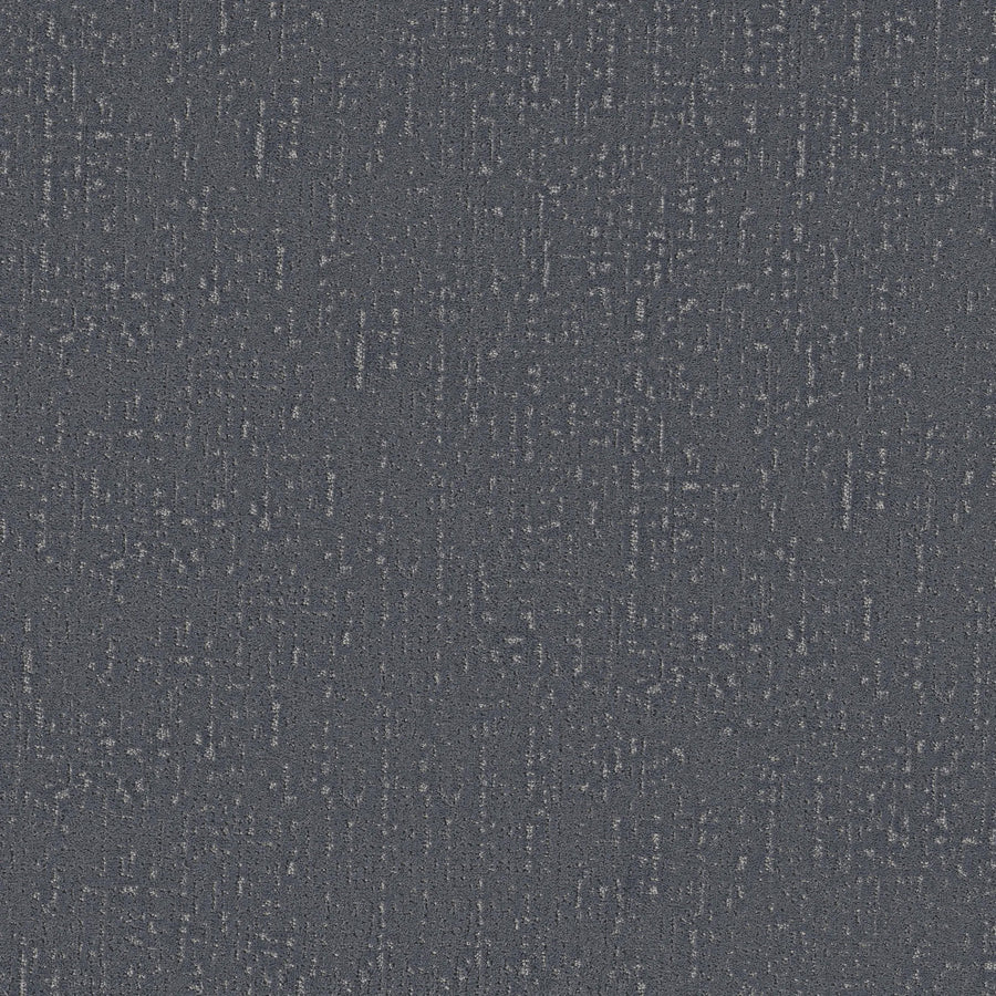 Curated Tone Pet Friendly Carpet in Washed Denim features a dark blue textured surface with subtle, irregular lighter and darker blue lines and speckles, evoking the look of woven, stain-resistant carpet fabric.