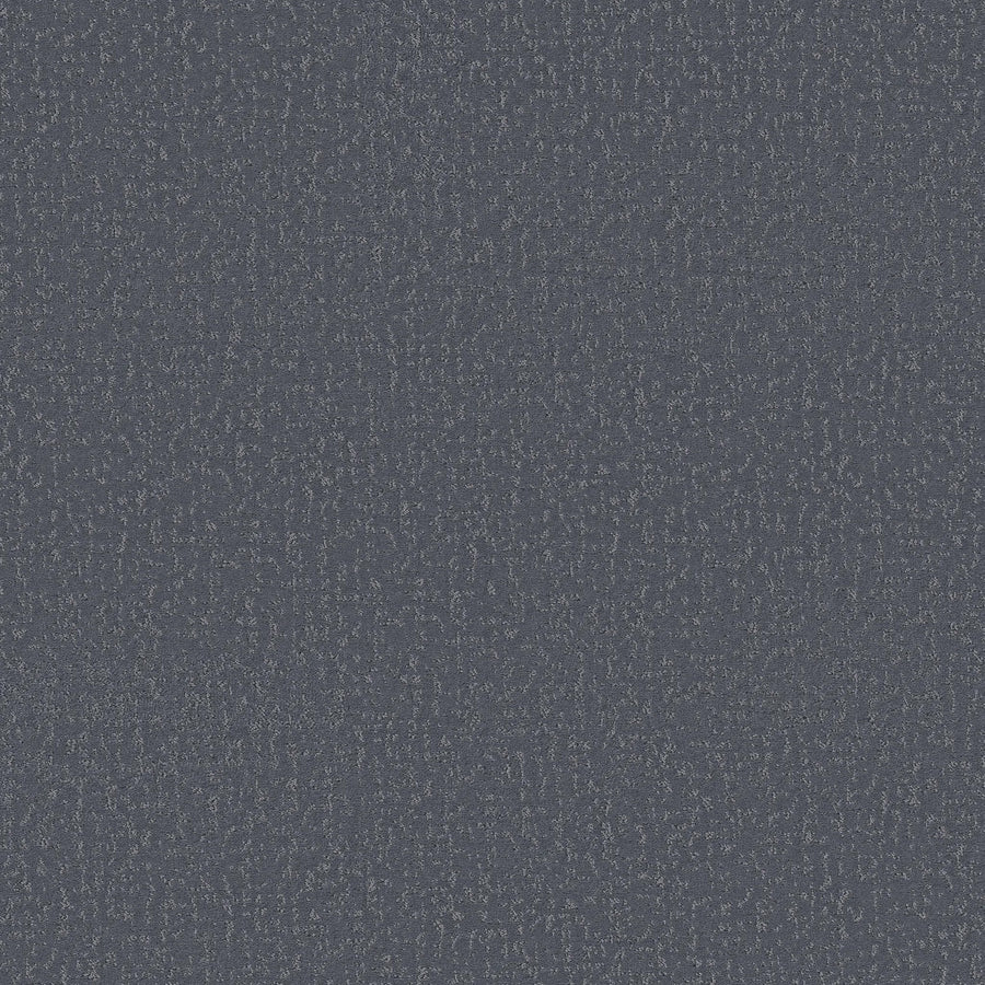 Close-up of Crafted Tone Pet Friendly Carpet in Washed Denim, showing its dark blue textured fabric with a subtle repeating pattern and slight color variations that enhance its stain-resistant appearance.
