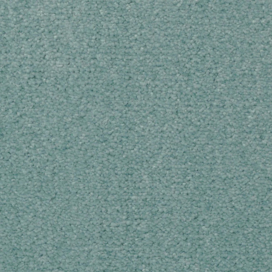 Close-up of Seduction On Trend Carpet in Waterscape color, showcasing a textured, light teal looped pile. The uniform surface offers comfort and durability, with no visible stains or markings.