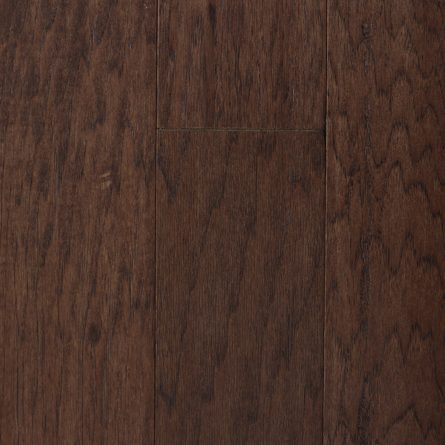 Deepwood Trail 5" Hickory Oak Hardwood in Wawona features a dark brown finish with visible grain patterns and slight color variations. The tightly fitted planks showcase the natural, rich wood texture, highlighting the elegance of this premium hardwood flooring.