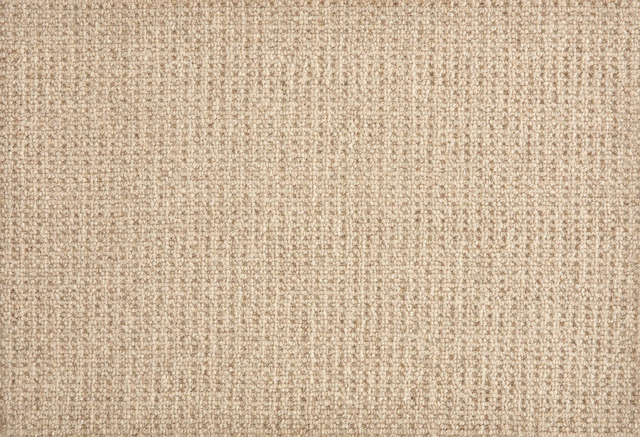 Close-up of Martina Berber Carpet in Weathered Oak, featuring a beige grid-like woven texture with a soft, raised surface—perfect for contemporary spaces or high-traffic areas needing a durable flooring solution.