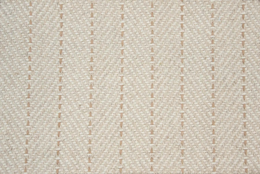 Close-up of Angola Berber Carpet in Wheat, featuring a textured surface with diagonal lines and small raised bumps, creating a contemporary, striped woven look.