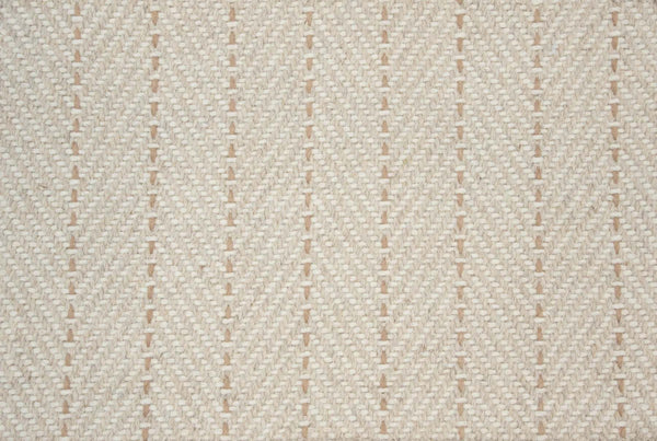 Close-up of Angola Berber Carpet in Wheat, featuring a textured surface with diagonal lines and small raised bumps, creating a contemporary, striped woven look.
