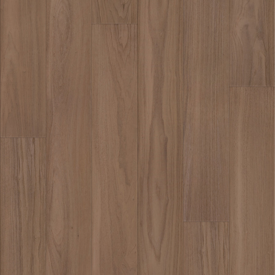 Close-up of Coretec Lakehouse Luxe 7.09" Vinyl Plank in Whiskey Oak, showing medium-brown tones, realistic wood grain, and a smooth surface for a quality hardwood look.