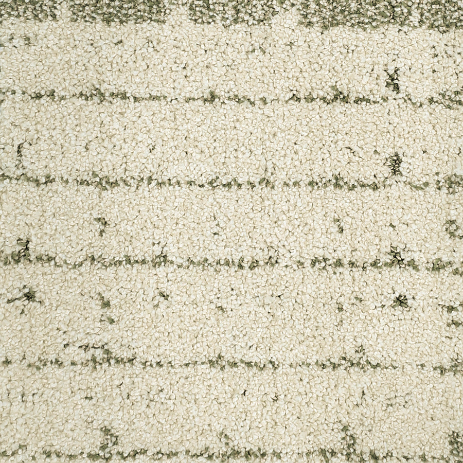 A close-up of the Furry Fun Pet Friendly Carpet reveals its cream color, soft looped fibers, and evenly spaced subtle green lines, creating a cozy, stylish look that's perfect for homes with pets.