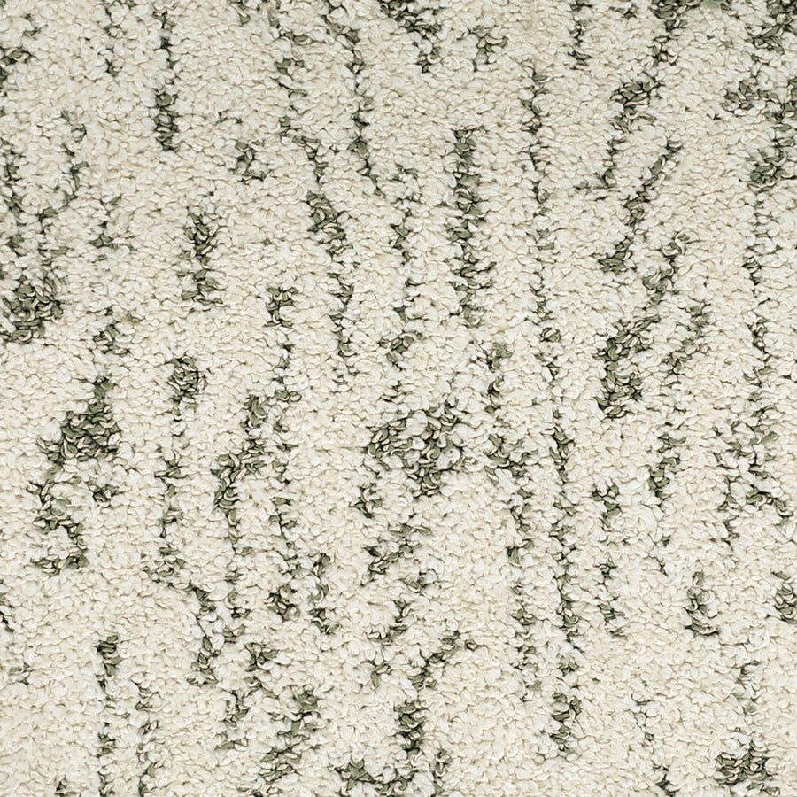 Close-up of Meow Mosaic Pet Friendly Carpet shows its cream surface with textured, irregular dark green vertical threads, creating a subtle mosaic design and highlighting its inviting, pet-friendly quality.