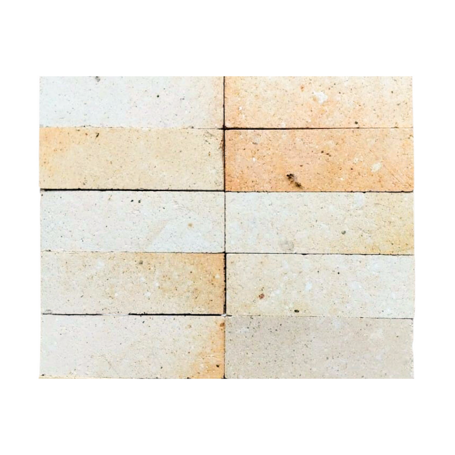 Twelve rectangular beige and light brown Atelier Clay 2x6 Mosaic Natural Stone tiles arranged in a 3x4 grid, creating a simple, orderly wall with neutral tones inspired by natural stone mosaics.