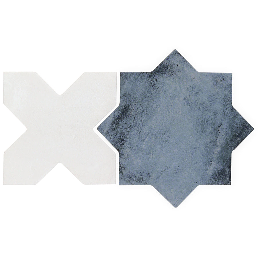 A white matte X-shaped tile and a dark gray Morocco Star & Cross Porcelain Tile with an eight-pointed star design are placed side by side on a white background.