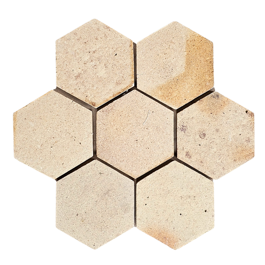 A close-up of Atelier Clay Hexagon Mosaic Natural Stone, highlighting its rich texture and earthy tones reminiscent of natural stone and terracotta tiles.