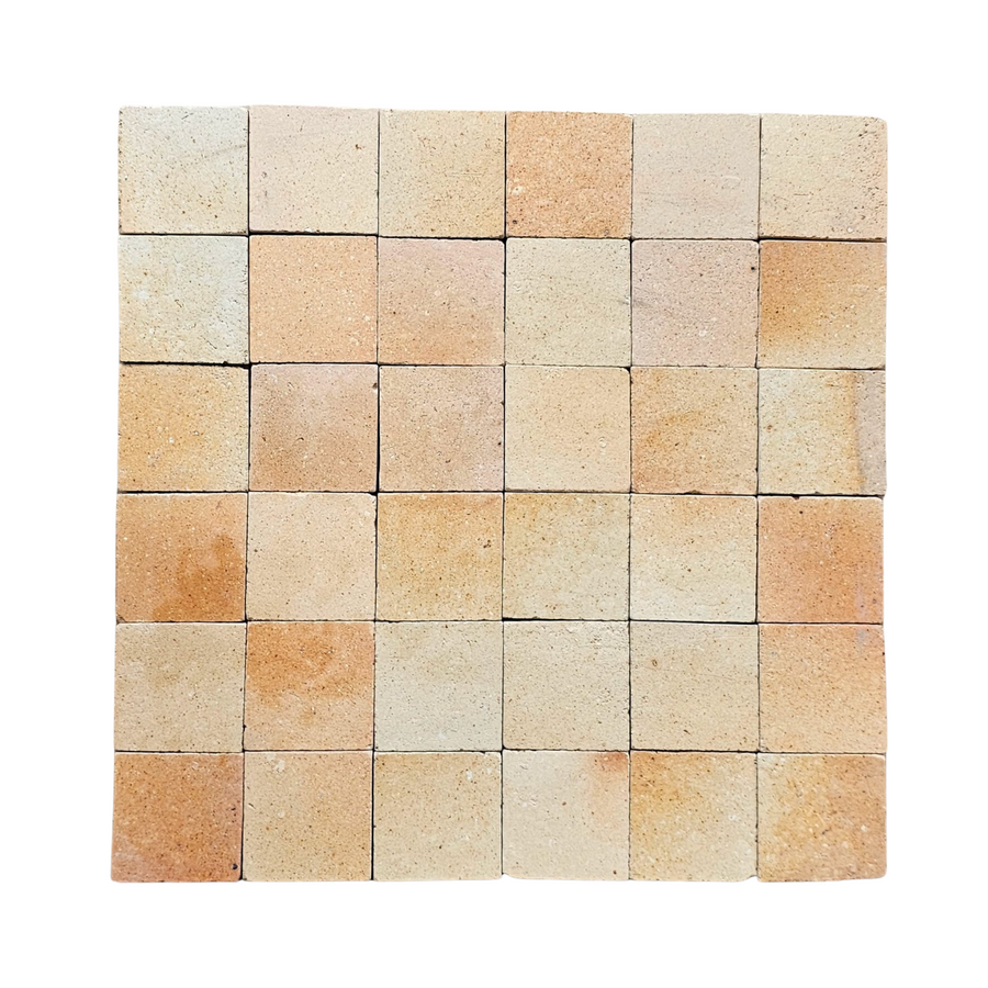 A 6x6 grid of Atelier Clay 2x2 Mosaic Natural Stone tiles in beige and light brown shades, each showing subtle variations in tone and texture, arranged on a white background.