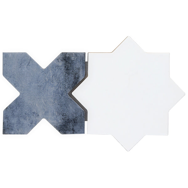 The Morocco Star & Cross Porcelain Tile set includes two interlocking tiles: one is a matte dark blue-gray with a textured finish, and the other is smooth white. Both are shaped like eight-pointed geometric stars or crosses.