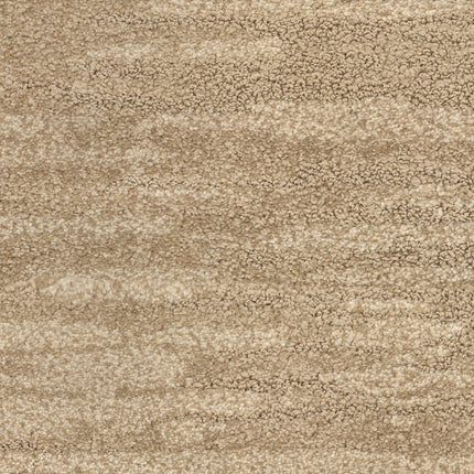 Close-up view of Cirrus Berber Carpet in Willow—the beige tones and subtle color variations create a soft, plush surface with a slightly mottled look, adding an inviting, premium touch to any space.