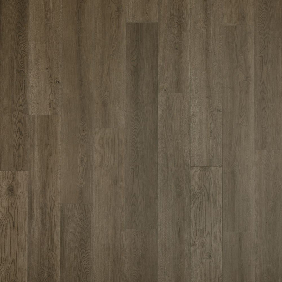 A close-up of Cordova Falls 7.5" Vinyl showcases brown planks with natural wood aesthetics and textured patterns. Subtle shade variations add realism and warmth, making it an ideal choice for durable, stylish flooring.