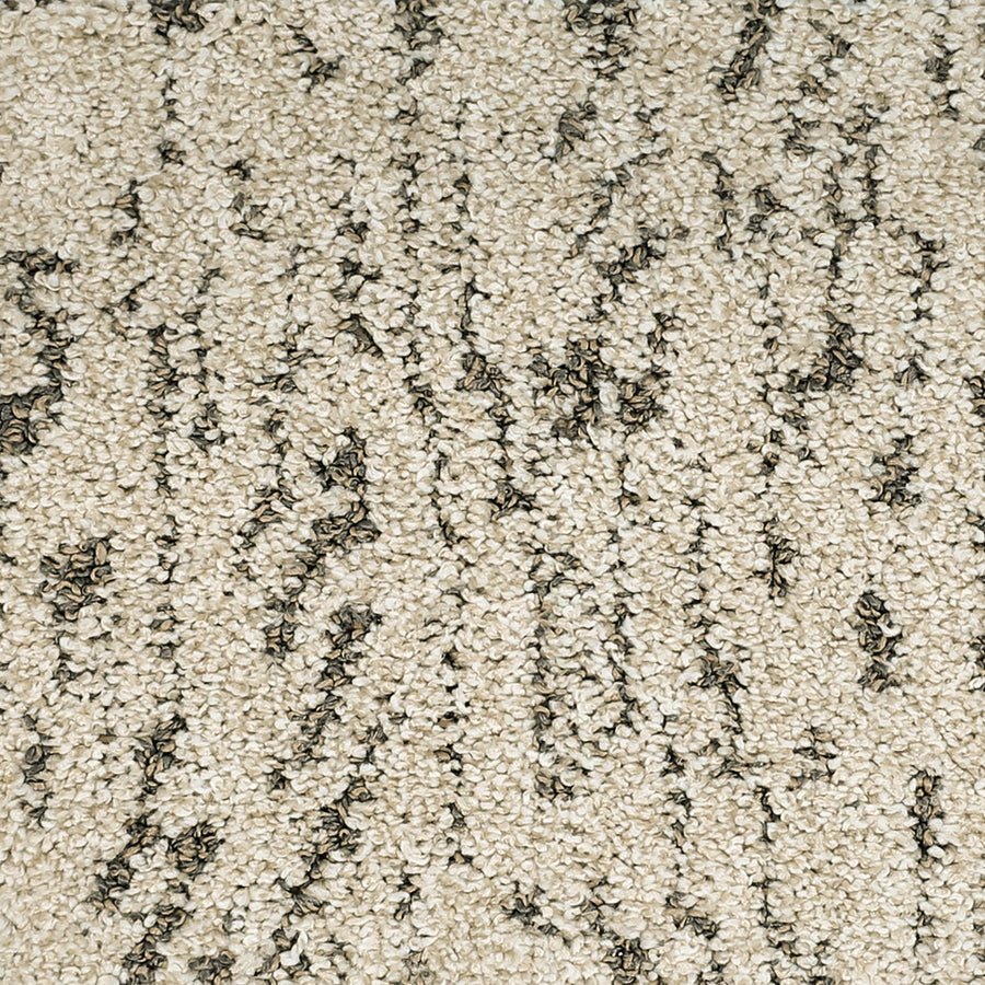 Close-up of Meow Mosaic Pet Friendly Carpet in beige, showcasing a textured looped surface with dark brown and black threads forming an abstract mosaic pattern.