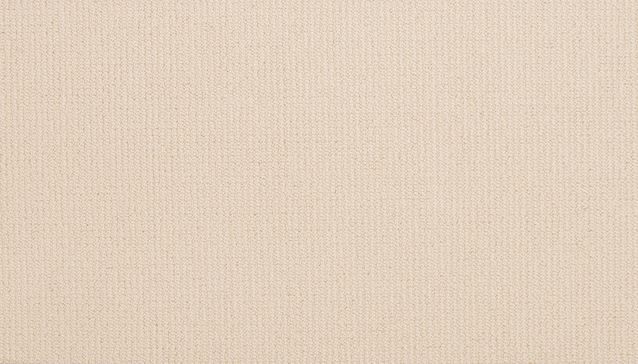 A close-up of Wool Fundamentals On Trend Carpet in Ivory shows its plain, cream tone with a subtle woven texture and visible threads, highlighting the natural, soft look and durable quality of wool carpeting.