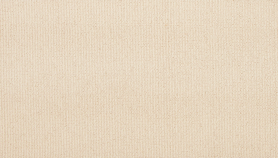 Close-up of Wool Fundamentals On Trend Carpet in Shimmer: a beige wool carpet with a subtle, even weave and fine threads, offering a uniform, neutral look ideal for durable wool flooring.