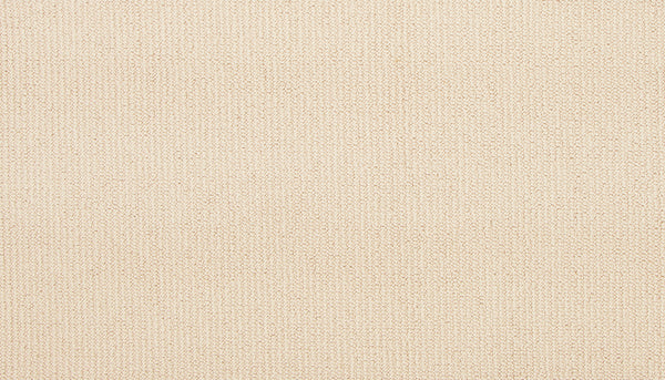 Close-up of Wool Fundamentals On Trend Carpet in Shimmer: a beige wool carpet with a subtle, even weave and fine threads, offering a uniform, neutral look ideal for durable wool flooring.