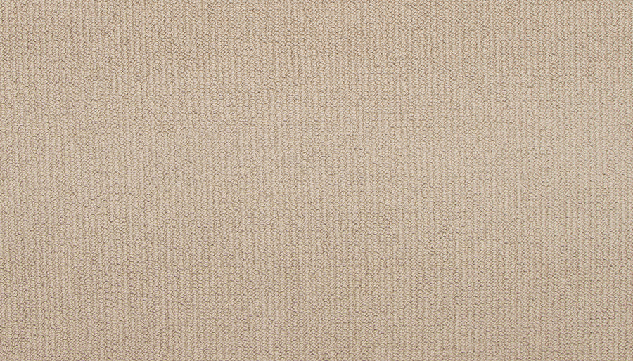 Close-up of Wool Fundamentals On Trend Carpet in Vanilla, featuring a soft, evenly colored beige weave with a subtle pattern. Its neutral, minimalistic look makes it an ideal backdrop for modern interiors.