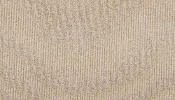 Close-up of Wool Fundamentals On Trend Carpet in Vanilla, featuring a soft, evenly colored beige weave with a subtle pattern. Its neutral, minimalistic look makes it an ideal backdrop for modern interiors.