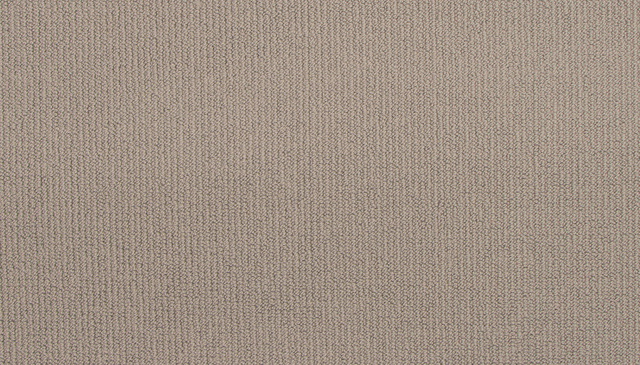 Close-up of Wool Fundamentals On Trend Carpet in Dove color, featuring a light brown, durable wool surface with a fine, uniform knit. The fabric is soft and tightly woven, displaying subtle variations in thread direction and shade.