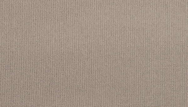 Close-up of Wool Fundamentals On Trend Carpet in Dove color, featuring a light brown, durable wool surface with a fine, uniform knit. The fabric is soft and tightly woven, displaying subtle variations in thread direction and shade.
