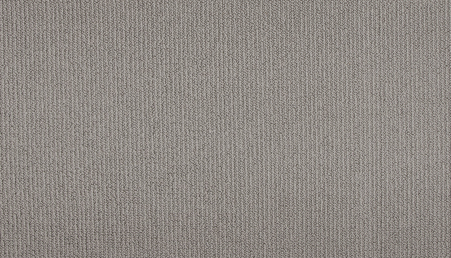 Close-up of Wool Fundamentals On Trend Carpet in Pewter, featuring a light gray hue and a uniform pattern of small, tightly woven threads for a textured weave appearance.