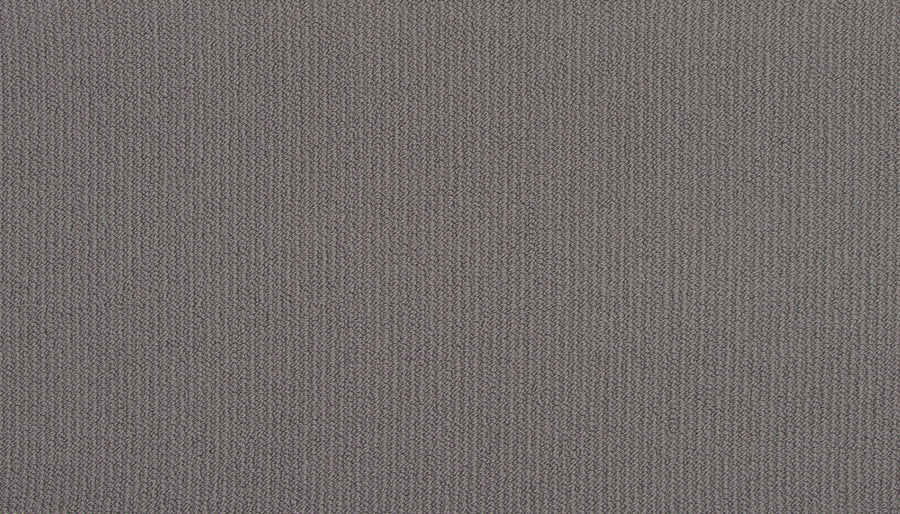 Close-up view of the Wool Fundamentals On Trend Carpet in Timber color, highlighting its textured wool surface with fine, evenly spaced threads and a soft, woven appearance.