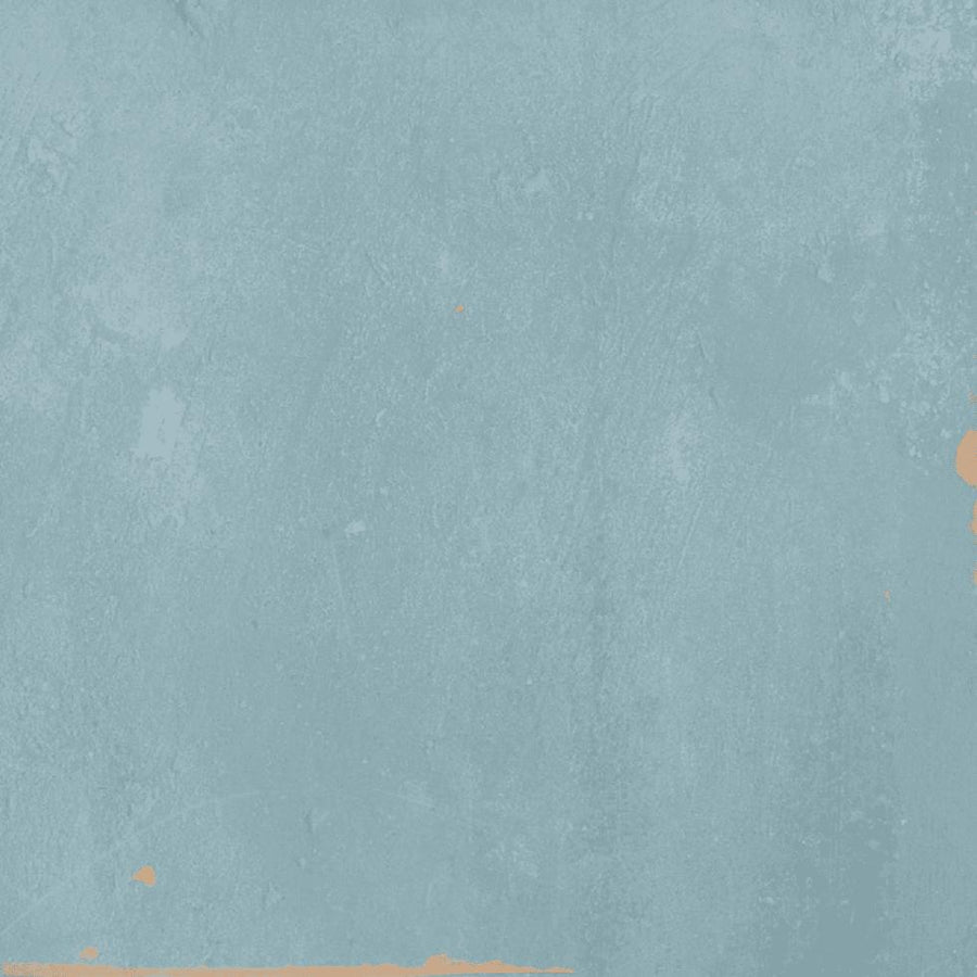 Light blue painted wall with a subtle, textured surface. Areas of light orange show through at the top right and bottom left edges, giving the image a slightly weathered or distressed appearance.