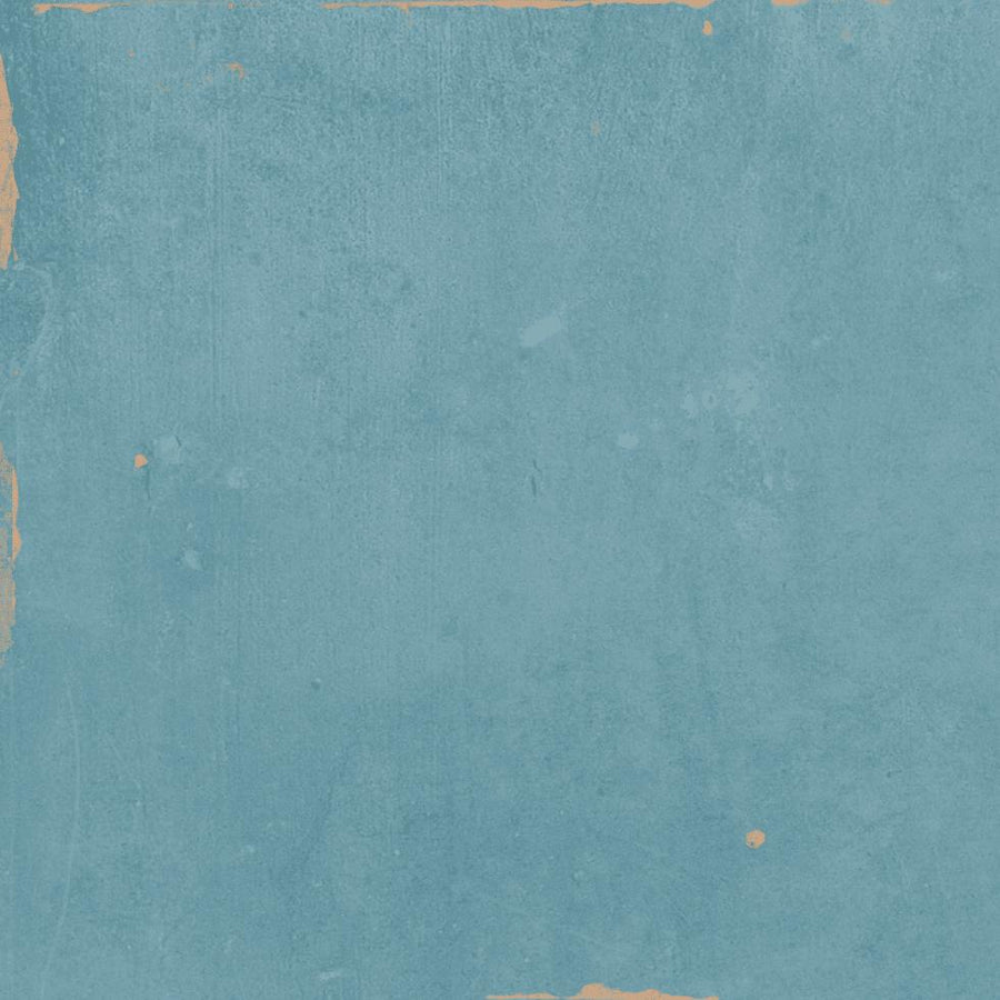 A textured blue background with rough, worn edges and small patches of tan discoloration, giving it a weathered, vintage appearance.