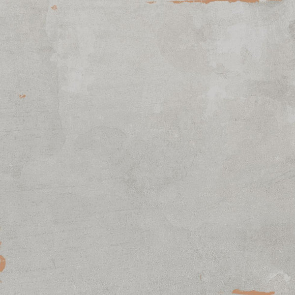 A textured, light gray concrete surface with subtle patches of white and faint orange-brown stains around the edges, creating a weathered, rustic appearance.