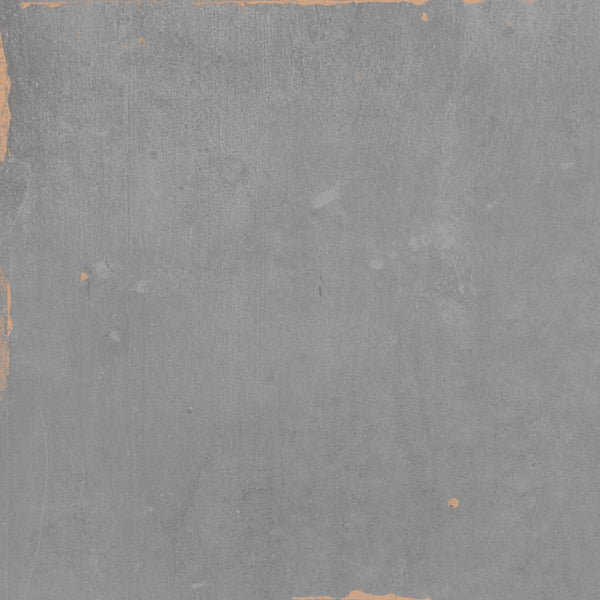 A textured gray concrete wall with rough, uneven surfaces and some chipped edges, particularly along the left side and top, revealing a slightly lighter underlayer.