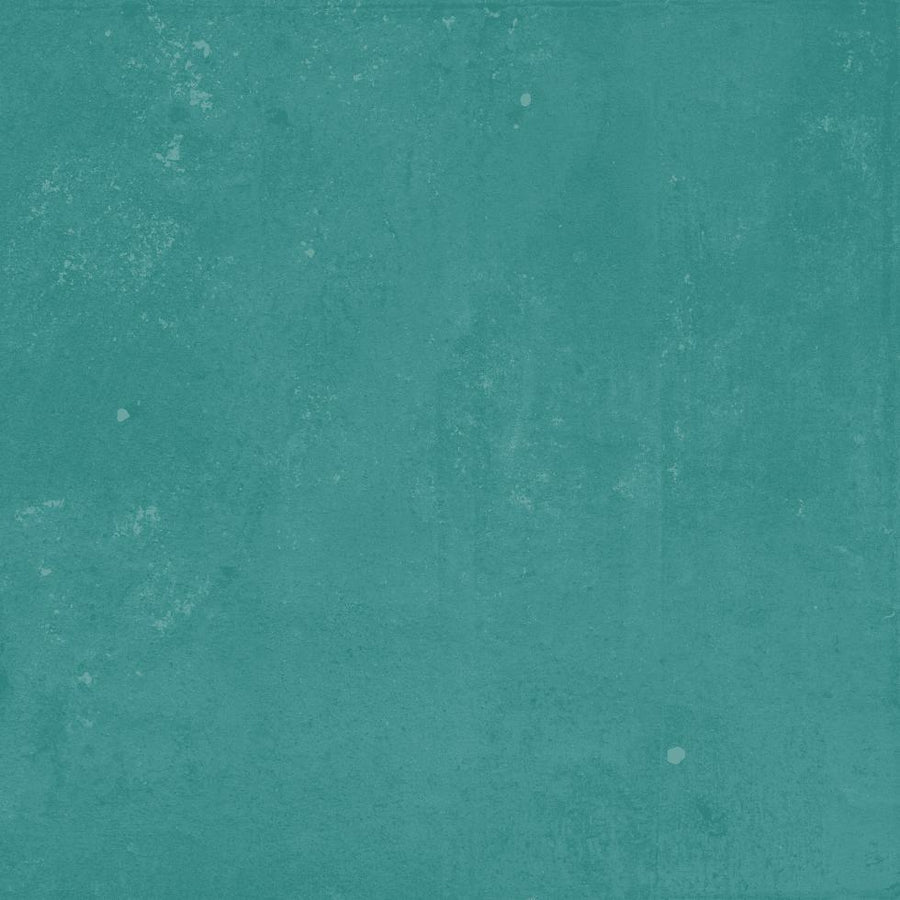 A textured teal background with subtle variations in color and small white speckles scattered across the surface.