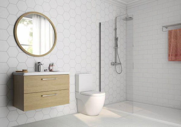 A bathroom with a mirror and sink.