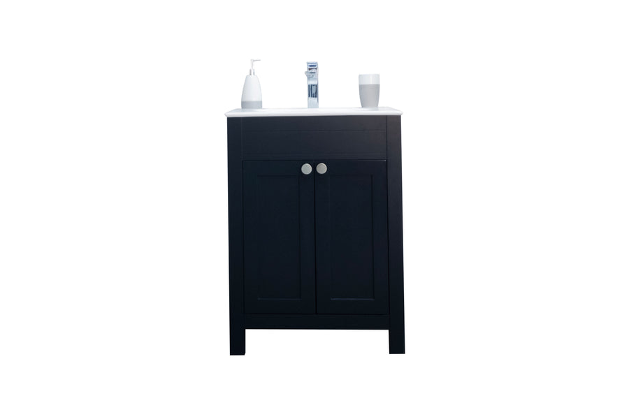 A black bathroom vanity with a white countertop, holding a soap dispenser, a tube, and a cup, set against a white background.