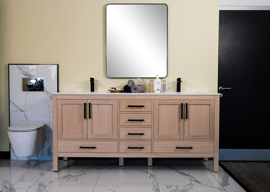 Modern bathroom with the Ashley 72" Double Bowl Vanity in natural oak, soft close drawers, double sinks, a large square mirror above, and a wall-mounted toilet on the left. White marble floor tiles contrast with a dark back wall and door.