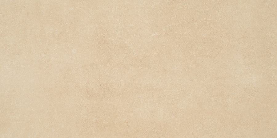 The Ardennes 12" x 24" Tile in Sand features a light beige textured surface with subtle shade variations, ideal for crafting an elegant accent wall or a minimalist statement floor.
